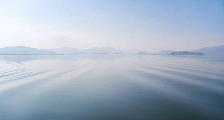 Calm river, idyllic landscape. Soothing water background.の写真素材