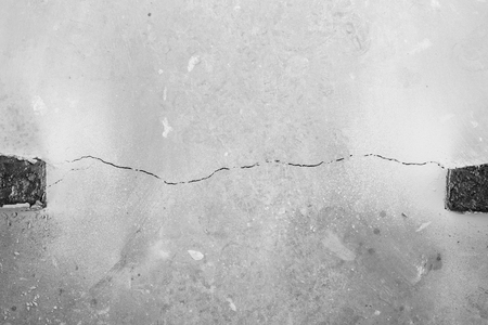 Crack in cement floor from shrinkage of house. The problem of construction. Background.の写真素材