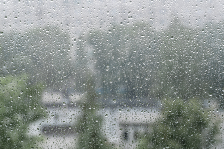 Rain drops on window. The beautiful background.の写真素材