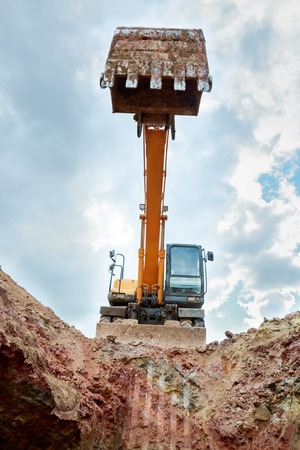 The excavator lifted the bucket. Bottom view.