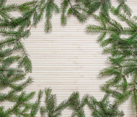 Christmas wooden background decorated fir branches