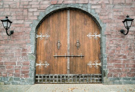 Old medieval wooden gate. Beautiful historic decoration.の写真素材