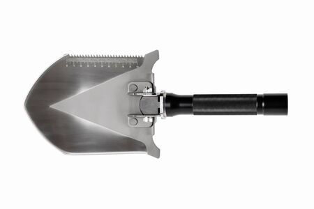 Sharp metal shovel with a saw on white background. Isolated.の写真素材