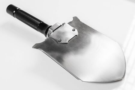 Shovel with a shock plate with function of hammer on a white background