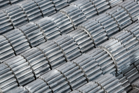 Large metal gears. New parts in stock. Industrial background.の写真素材