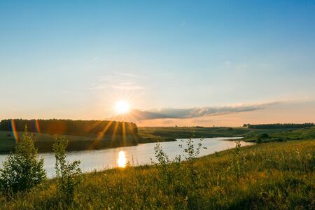 Sunset on the lake. Beautiful peaceful landscape.