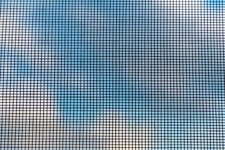 Protective insect net against the sky. Beautiful background.