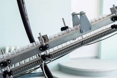 The necks of plastic bottles on the conveyor. Production line.の写真素材