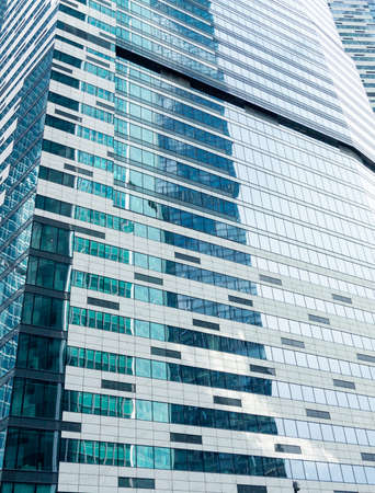 Moscow, Russia - July 12, 2020: The modern skyscraper closeup. Vertical beautiful background.