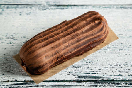 Custard cake on an old wooden background.
