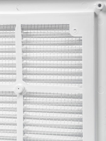 Plastic ventilation grate close-up. Back side with mesh. Color is white.の写真素材