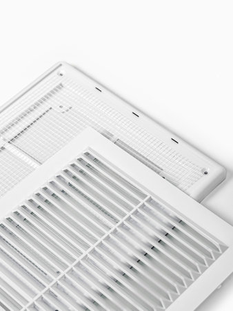 Plastic ventilation grate is isolated on a white background. Close-up.の写真素材
