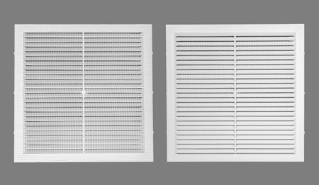 White ventilation grate on a gray background. Square shape, plastic material. Front and back sides. Top view.の写真素材