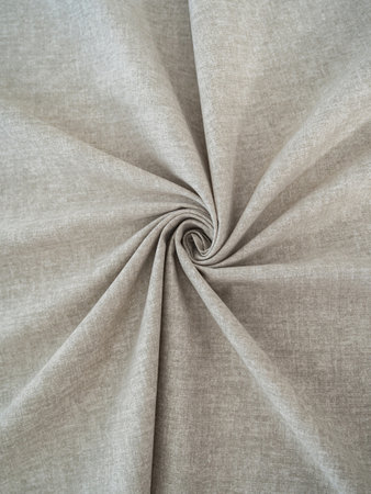 Soft beige fabric. Beautiful folds. Closeup.の写真素材