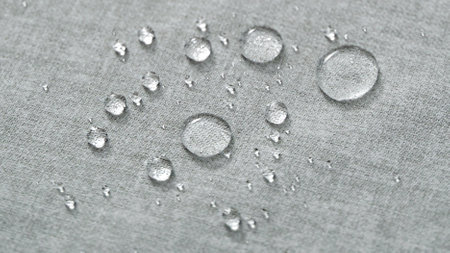 Water drops on a gray water-repellent fabric. Closeup.の写真素材