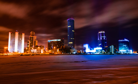 Colorful cityscape of Yekaterinburg at winter night with bright lights of buildingsの写真素材