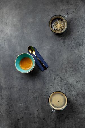 3 cups of coffee on grey background with negative space top view. Filter coffee espresso and americanoの写真素材