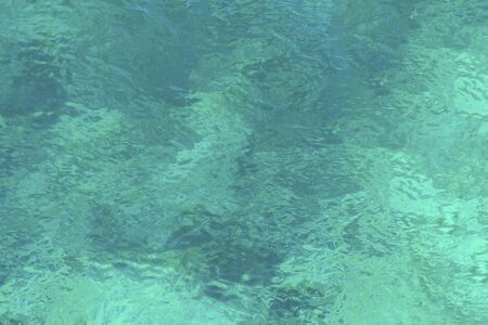 Clear turquoise sea water with a view of the bottomの写真素材