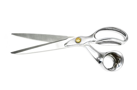 Pair of tailor scissors with metal golden handle isolated on white background.の写真素材