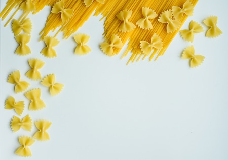 Uncooked pasta spaghetti macaroni isolated on white backgroundの写真素材