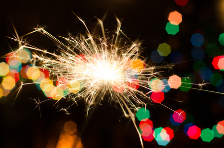 Bengal fire on Christmas tree background