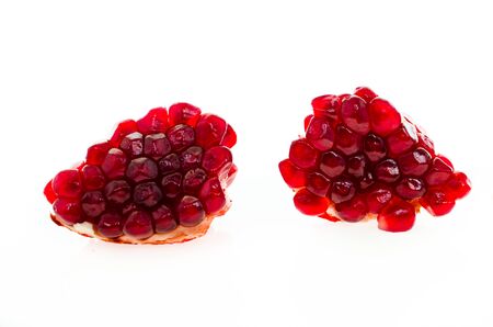 fresh ripe pomegranates on white isolated backgroundの写真素材