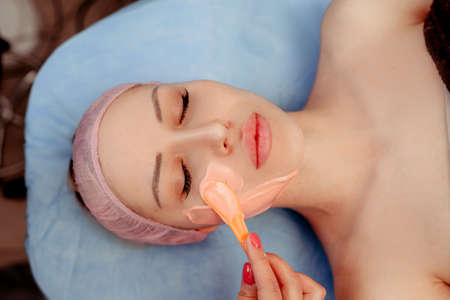 application of a cosmetic mask on the face, skin care.の写真素材