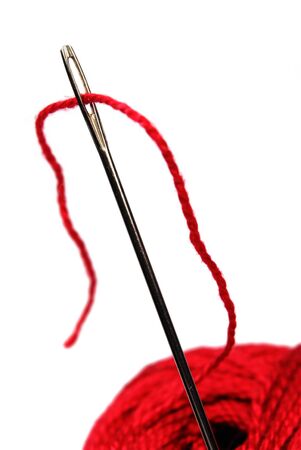 clew and needle isolated on whiteの写真素材