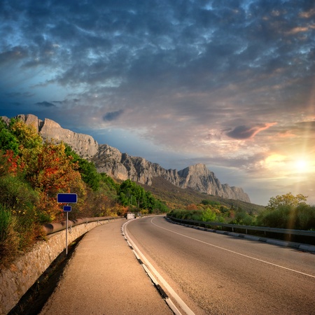 mountain sunset and road without carsの写真素材