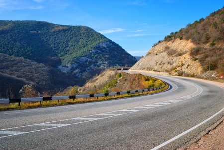 highway among the mountains and blue skyの写真素材