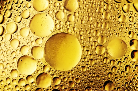 macro of oil drops on the waterの写真素材