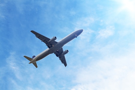 airplane in blue sky and sunlight