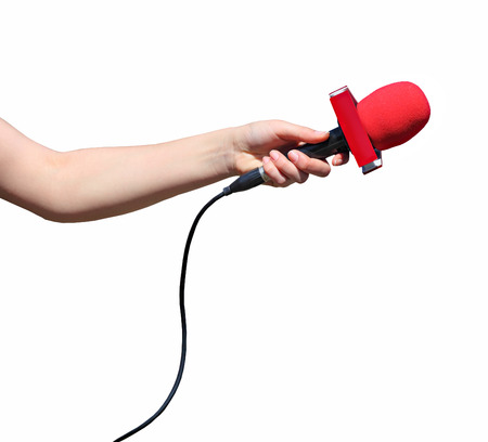Hand with red microphone isolated on white backgroundの写真素材