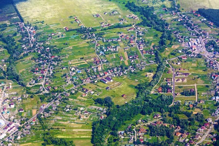 Aerial view of city suburb with many houses