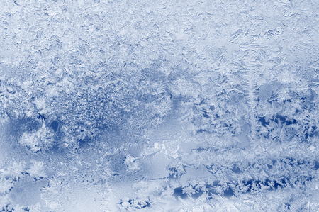Ice rime pattern on frozen glass. Abstract natural backgroundの写真素材