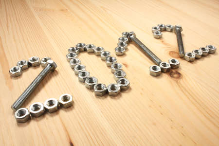 Digits 2012 of bolts and nuts on wood tableの写真素材