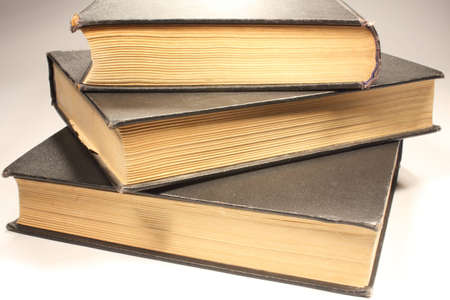 Three old books on white backgroundの写真素材