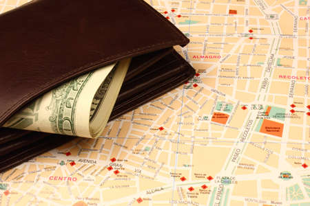 Wallet with banknotes on city map の写真素材
