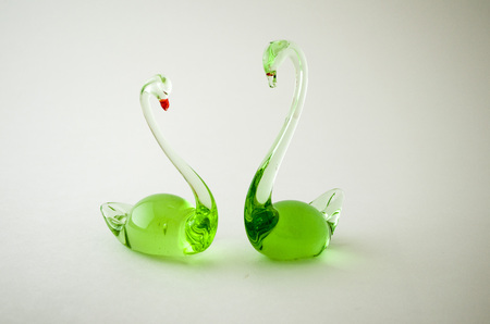Figurines made of glass. Two glass swan.の写真素材