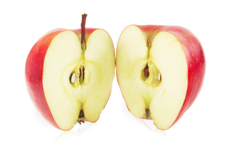 Red apple cut into two partsの写真素材