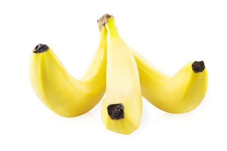 Three bananas in a bunchの写真素材