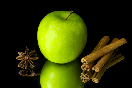 Green apple and star anise with cinnamonの写真素材