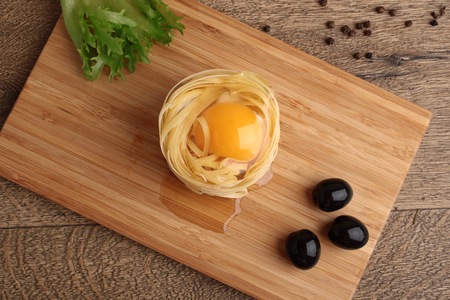 Fettuccini nests with egg
