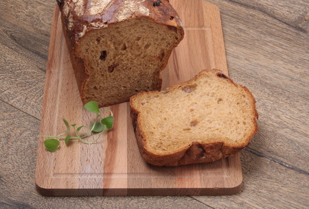 Sliced black bread on the wooden plank