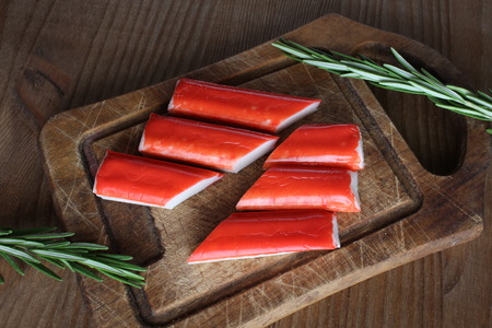 crab sticks on a wooden backgroundの写真素材