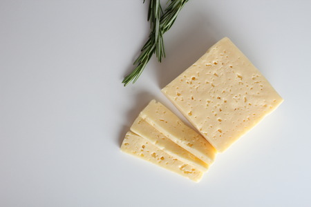 cheese cut into white backgroundの写真素材