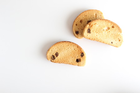 hardtack biscuits with raisins on white backgroundの写真素材