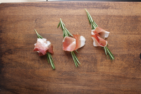 prosciutto, jamon on a wooden backgroundの写真素材