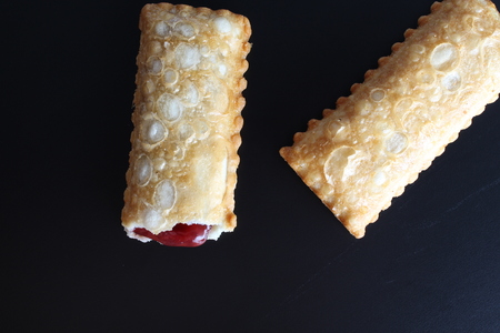 cherry pie Oil fried wild berries jam on a black background