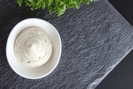mayonnaise sauce, sour cream on a stone backgroundの写真素材